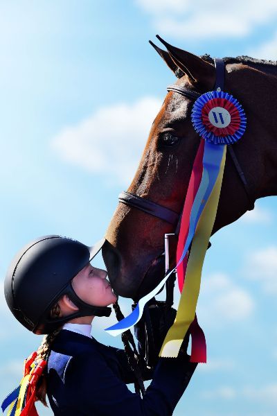Image of girl kissing horse