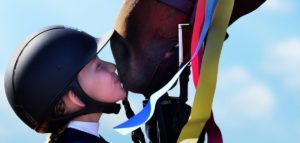 image of girl thanking her horse